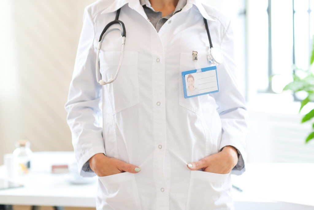Physician reviewing medical malpractice insurance coverage