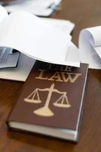Physician reviewing an employment agreement and malpractice insurance provisions